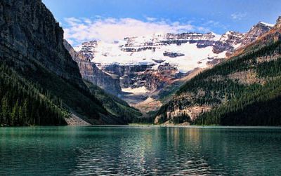 Lake Louise, one of the world’s most beautiful compositions of water, rock and ice, belongs to Canada. The small lake attracts throngs of tourists while serving as a stepping stone to surrounding wilderness areas of the Rocky Mountains.
