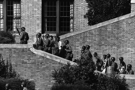 Soldiers from the 101st Airborne Division escort the Little Rock Nine students into the all-white Central High School in Little Rock, Ark.