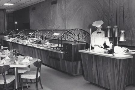 One of the first "sneeze guards" appeared in Johnny Garneau's American Style Smorgasbord in Monroeville 1958.