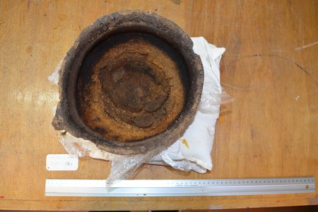 A 3,000-year-old clay pot with cheese residue found burnt to the bottom.