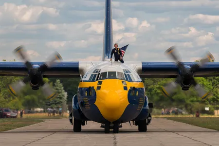 Fat Albert arrives at Traverse City, Michigan in 2018 with the crew chief (on top) spotting for any obstruction as it taxis on the tarmac.