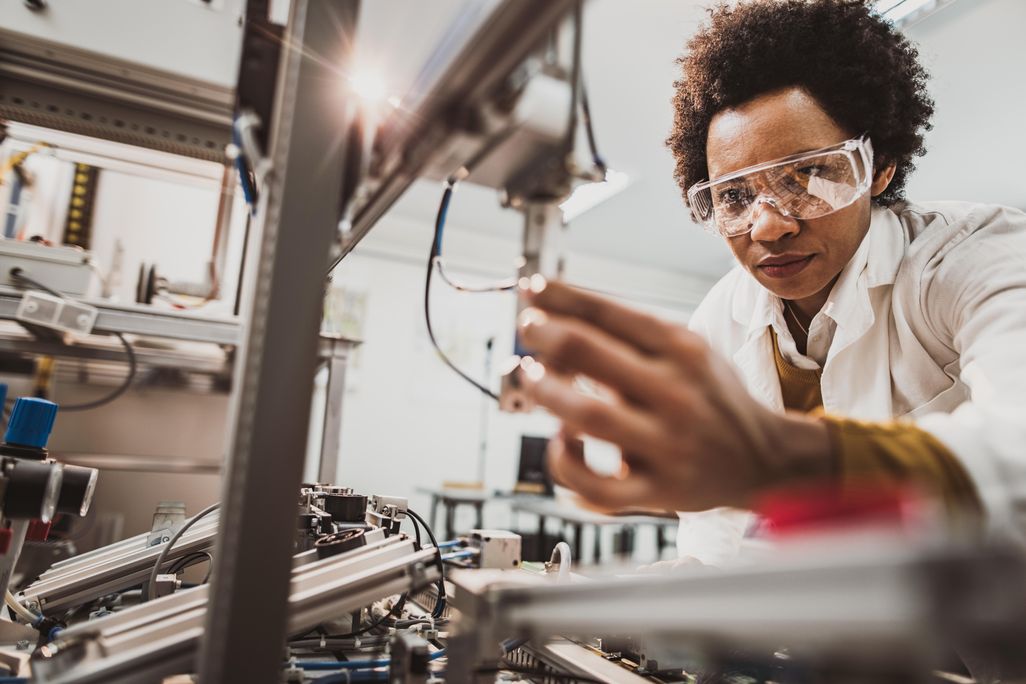 Black scientist studying sample