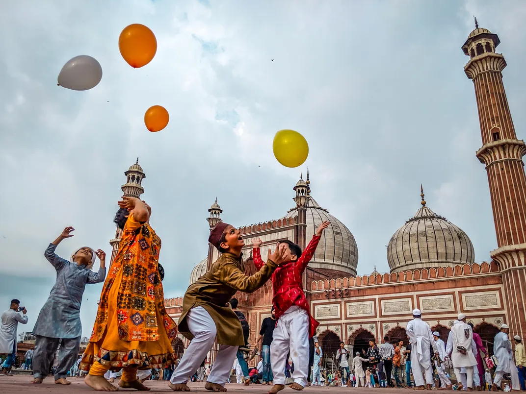 Children play with balloons