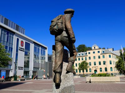 A statue in Joachim Ronneberg's honor stands tall outside the city hall in Alesund
