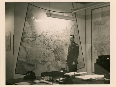 There are few images of the top-secret map room. This one, taken at the end of WWII, shows Army Chief Warrant Officer Albert Cornelius standing before a map of Europe.
