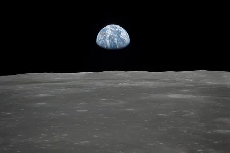 Earth rises over the moon&#39;s horizon, as seen from the Apollo 11 spacecraft in 1969.