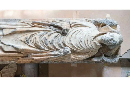The statue, which dates back to around 1348, likely depicts John de Belton, a priest who died of the Black Death. 