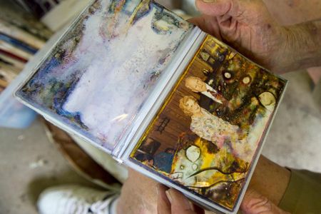 Clyde R. Meyers, Denham Springs flood survivor, holds a photograph of his parents, saturated with floodwater from the 2016 historic flooding in Louisiana. 