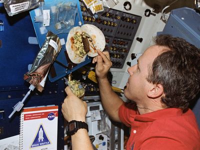 Tom Jones making a breakfast burrito in space. Meals are easier on the ground, and there’s more variety.