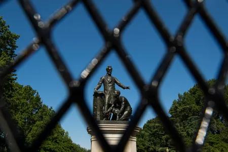 Now behind fences erected by the police, the Emancipation Memorial in Washington, D.C.'s Lincoln Park has been criticized ever since its dedication.