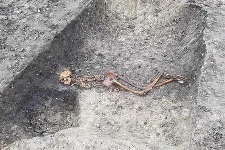 Researchers say the Iron Age man—found facedown with his hands bound together near the waist—was likely murdered or executed. 
