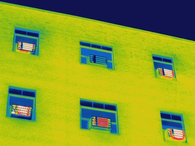Thermal image of window mounted AC units in an apartment building.