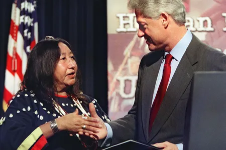 Tillie Black Bear accepts congratulations from President Bill Clinton after receiving the Eleanor Roosevelt Human Rights Award in December 2000.