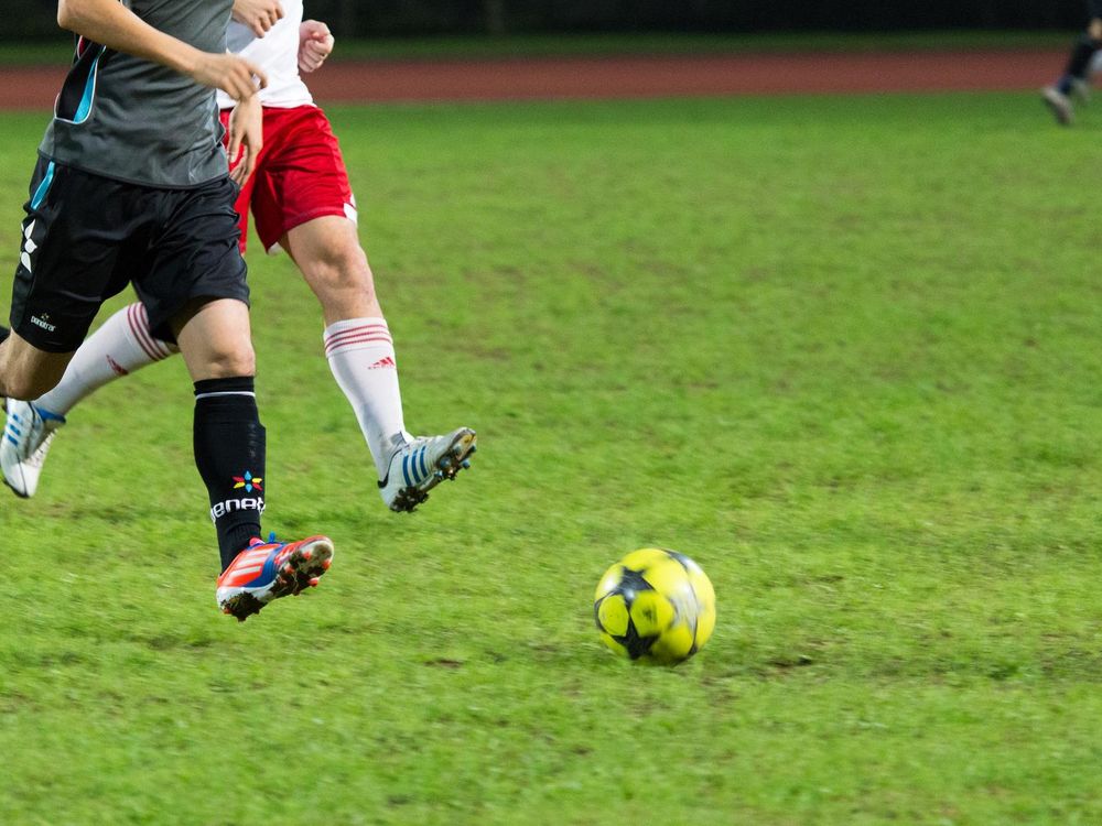 Men Playing Soccer