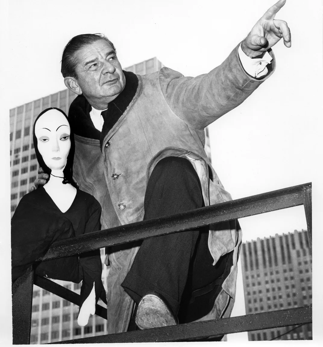 Charles Addams with a Morticia doll.