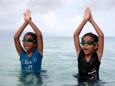 Twins Ida and Irene practice swimming in a learn-to-swim program on Eydhafushi, an island in the Maldives. 
