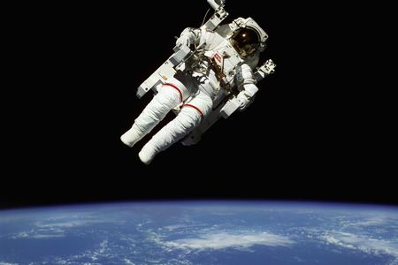 Space shuttle astronaut Bruce McCandless floats in space