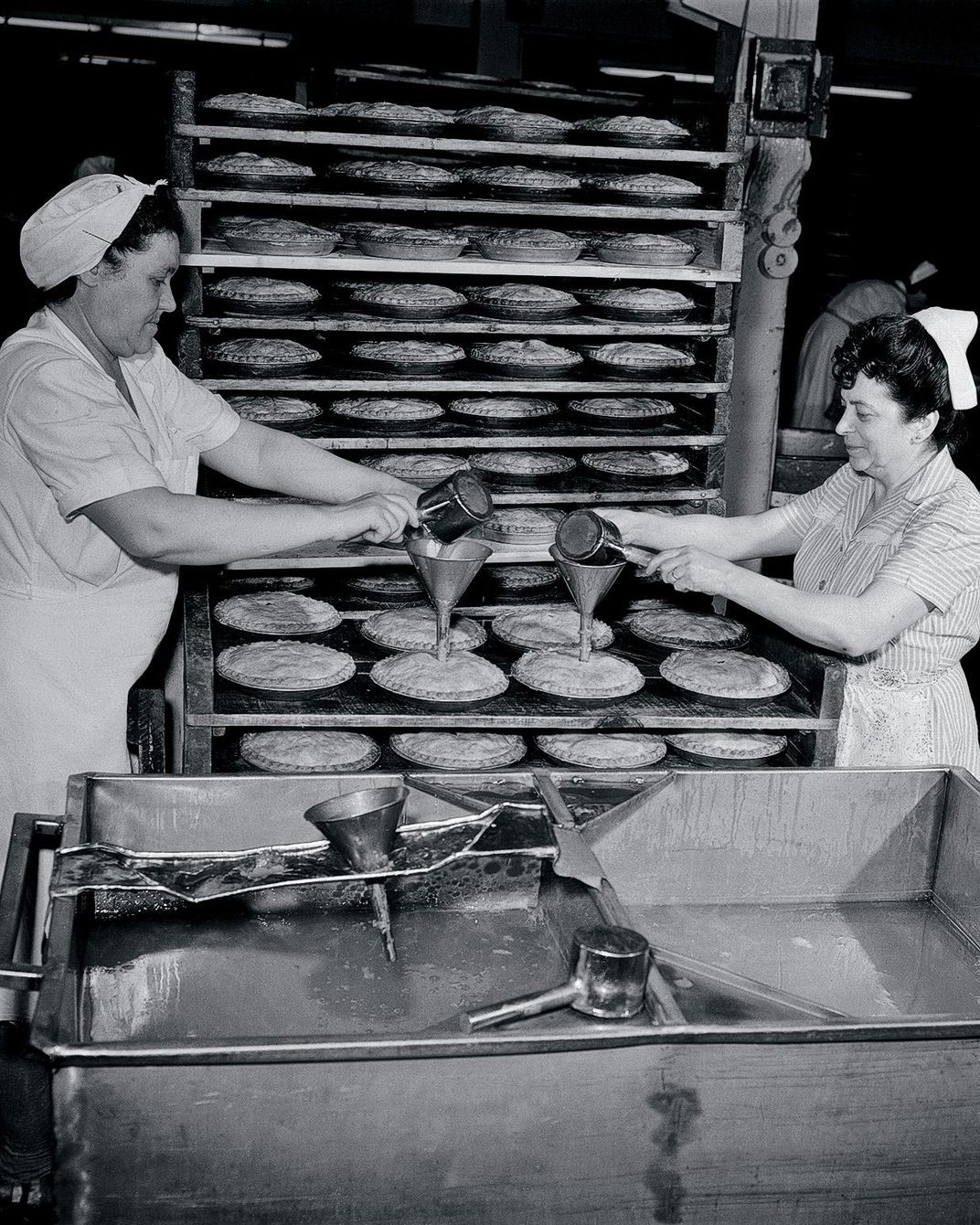 Women working on apple pies