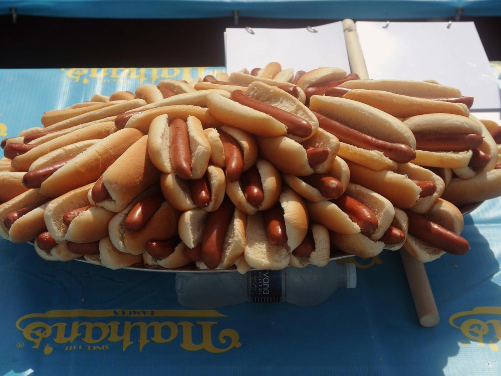 A massive platter of hot dogs in buns