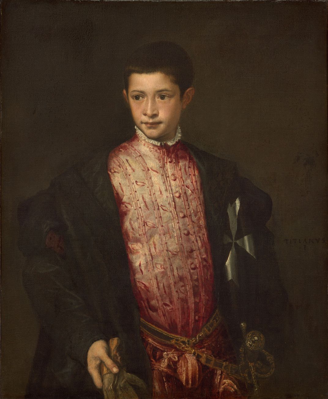 A portrait of a young boy wearing elaborate robes and standing in front of a dark brown background