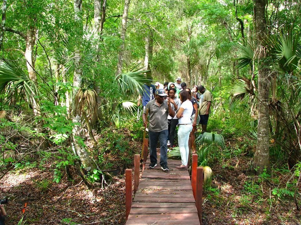 High school students tour Marvin Dunn's Rosewood property.