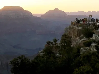 Visitors gather on the South Rim of Grand Canyon National Park after its reopening.