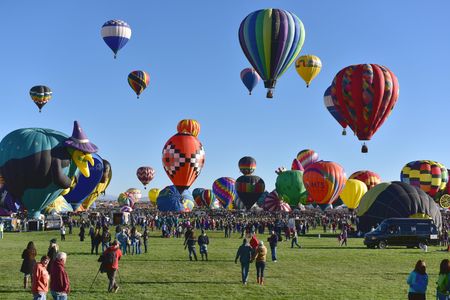 Balloons taking off during the Mass Ascension at the opening of the International Balloon Fiesta at Balloon Fiesta Park in Albuquerque, New Mexico. 
