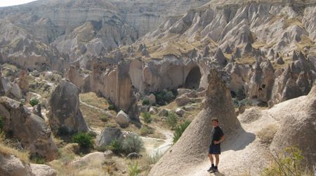 The author stands amidst weirdness in the Cappadocian village of Zelve.