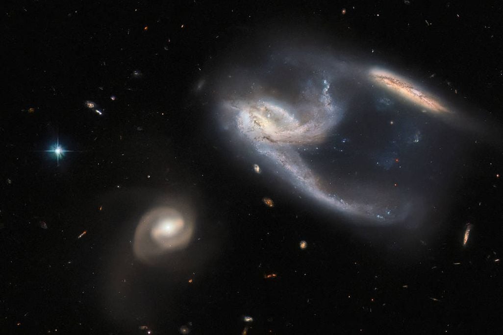 An image of three swirling galaxies taken by the Hubble Space Telescope