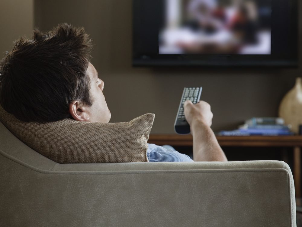 man watching television