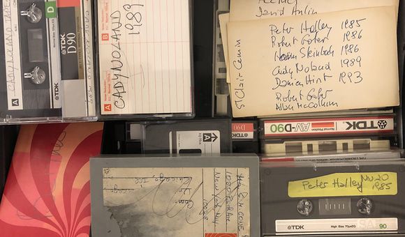 Color image of various audio recordings, some with handwritten labels.