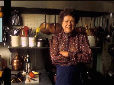Julia Child stands in the kitchen of her Massachusetts home. You can own another one of her kitchens—the one in her Provence vacation home—for just $885,000. 