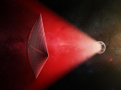 An artists rendering of how a solar sail might be powered by a radio beam from the surface of a planet