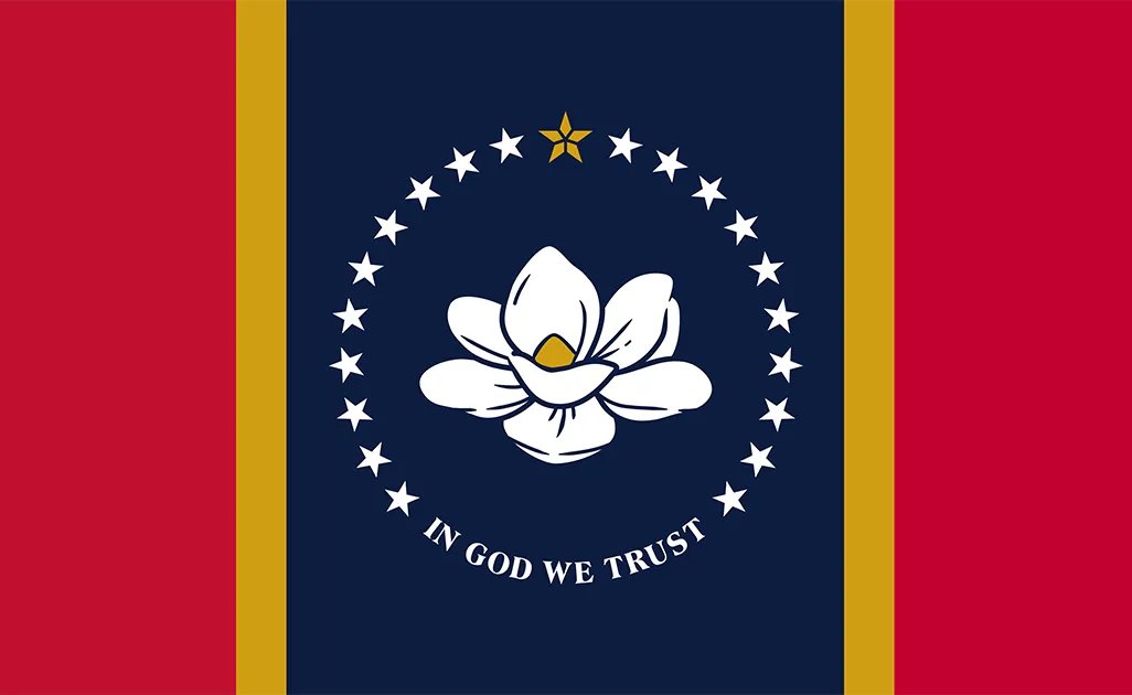 Two vertical thick red stripes and thin gold stripes flank either side of a navy blue stripe in the center, which boasts a large blooming white magnolia flower, its petals unfurling. Circled by 20 stars and white text below: "IN GOD WE TRUST"