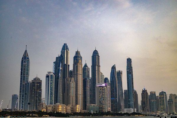 Dubai buildings looking back from a boat thumbnail