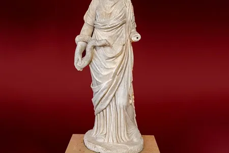 A different headless statue of health goddess Hygieia