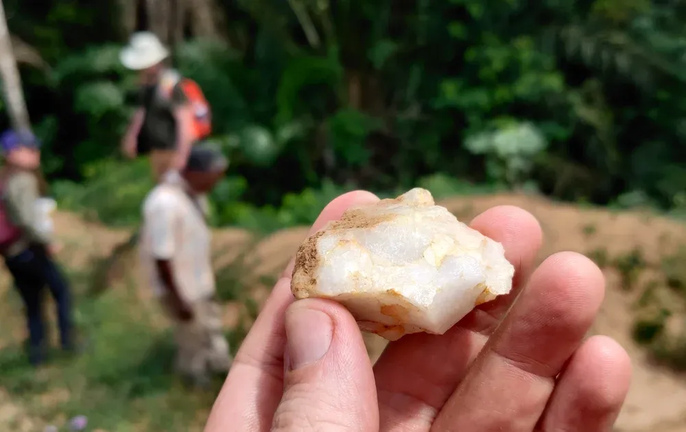 Small stone tool held in a person's fingers