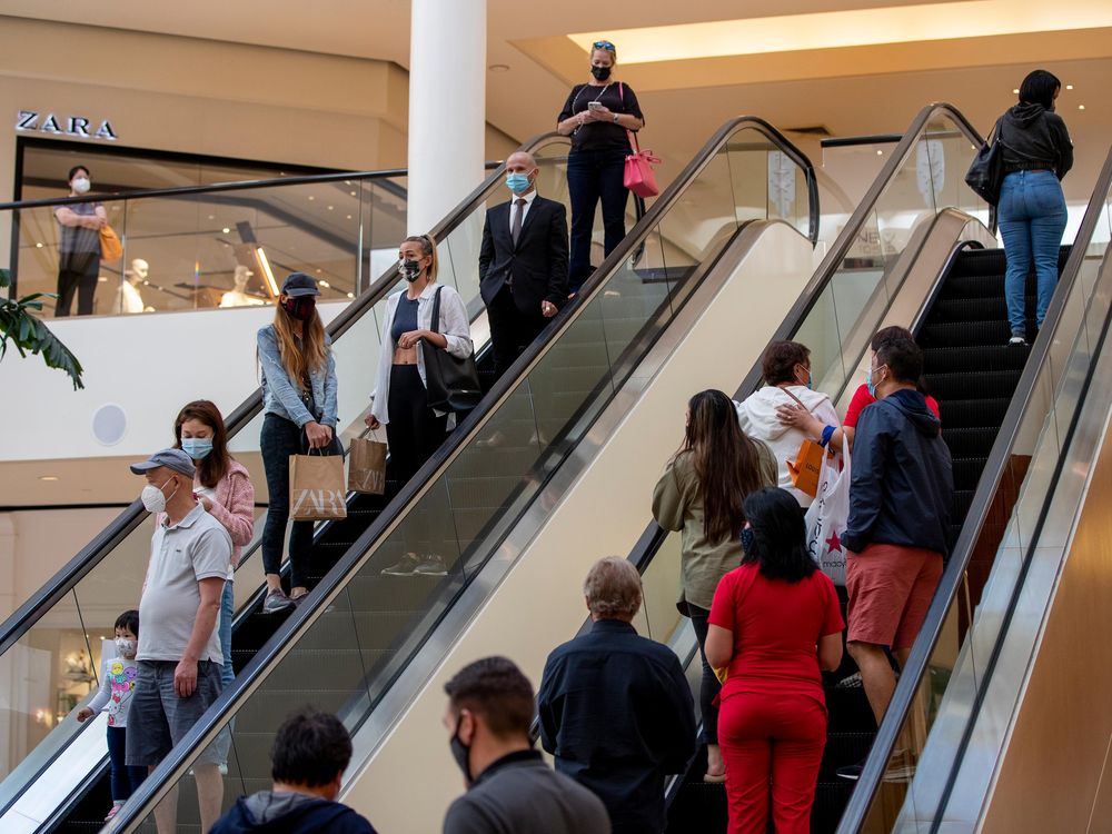 Shoppers continue to wear masks inside South Coast Plaza on May 13, 2021 in Costa Mesa, California. 