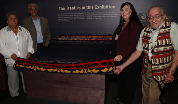 Delaware leaders prepare to unveil the Treaty of Fort Pitt, on view at the National Museum of the American Indian in Washington, D.C. From left to right: Denise Stonefish, chief of the Delaware Nation at Moraviantown; museum director Kevin Gover; Chester “Chet’ Brooks, chief of the Delaware Tribe of Indians; and Deborah Dotson, president of the Delaware Nation. May 10, 2018, Washington, D.C. (Paul Morigi/AP Images for the National Museum of the American Indian, Smithsonian)
