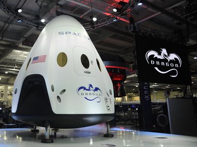 CEO & Chief Designer Elon Musk unveils the new SpaceX's Dragon V2 spacecraft Thursday evening at SapceX HQ. The Dragon V2 is the next generation spacecraft designed to carry astronauts into space.