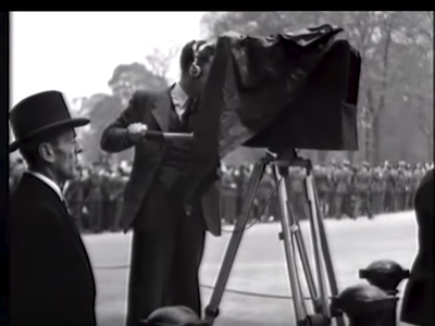 A cameraman at the coronation of King George V.