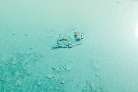 This 133-foot long wooden steamer, the Rising Sun, is in 6 to 12 feet of water just north of Pyramid Point, where she stranded on October 29, 1917. All 32 people on board were saved.
