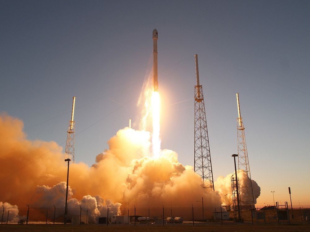The falcon 9 spaceX rocket launching Cape Canaveral in Florida in 2015 with blue sky backdrop