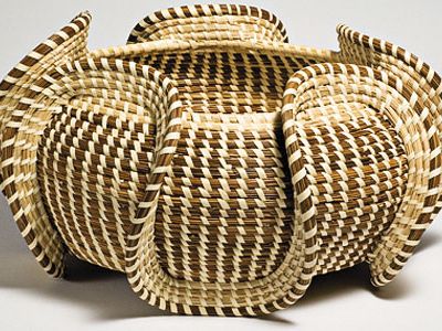 African slaves brought their art of basket weaving to the American South.  See samples such as this wave basket through November 28 at African Art.