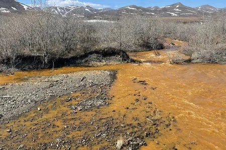 An orange tributary of the Kugororuk River.