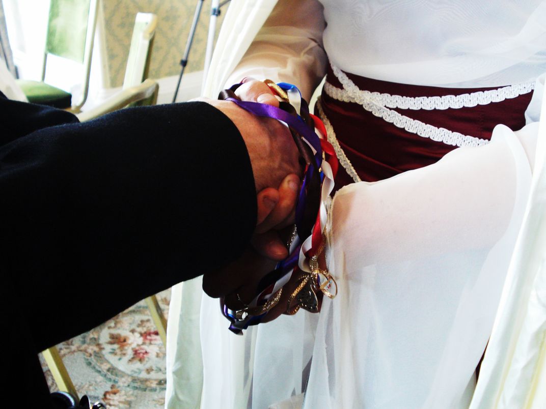 The tying of the chords- symbolising the bonding between two people ...