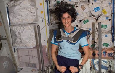 Astronaut Sunita Williams strikes a pose during an exercise session on the space station.