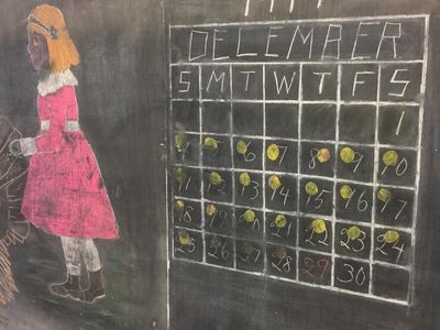 One of the chalkboards shows a calendar in the process of switching from November 1917 to December — only the month label and the first day apply to the new month.