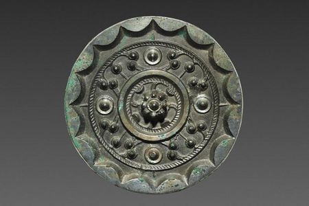 Bronze mirrors like the one pictured here were luxury items in Han dynasty China. Researchers recently discovered a trove of 80 ancient mirrors at a cemetery in Shaanxi Province.