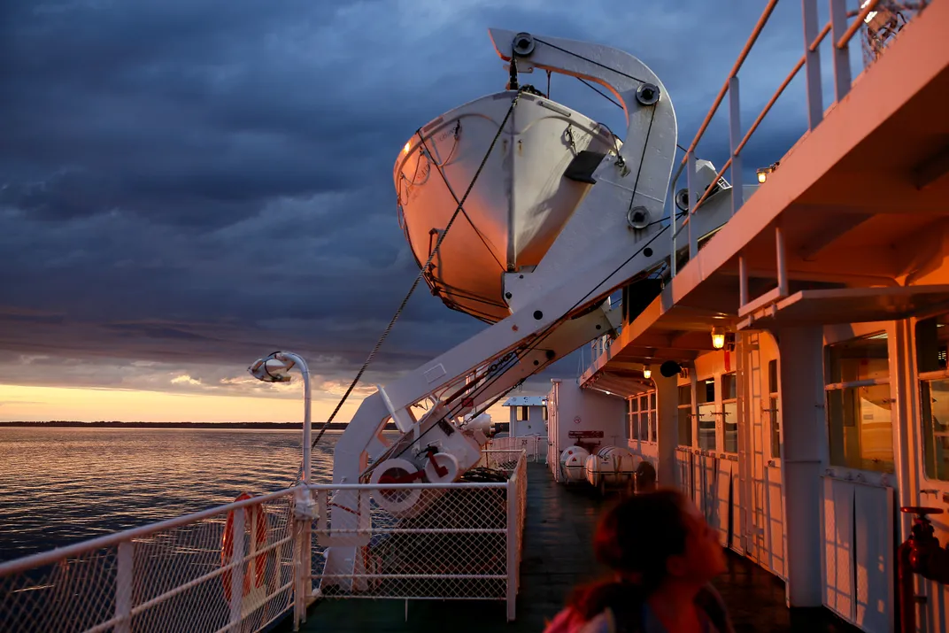 6 - The setting sun adds a serene ambiance for passengers on a ferry connecting Prince Edward Island to Nova Scotia.